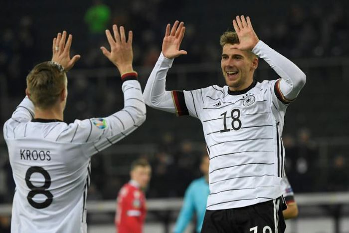 Goal scorers Leon Goretzka (R) and Toni Kroos (L) celebrate as Germany brushed past Belarus with a 4-0 win to qualify for Euro 2020