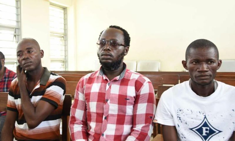 Tanzanian journalist Erick Kabendera (C), seen here in an earlier court appearance, was released after he pleaded guilty