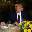 (FILES) In this file photo US President Donald Trump (R) speaks with Brazilian President Jair Bolsonaro during a dinner at Mar-a-Lago in Palm Beach, Florida, on March 7, 2020