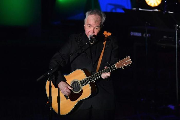US singer-songwriter John Prine, pictured June 2019, has been hospitalized and intubated due to a "sudden onset of Covid-19 symptoms," according to his family