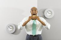 Businessman Eating Quick Lunch