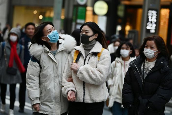 Ordinary Japanese have started wearing facemasks to guard against the spread of the deadly virus which began in the Chinese city of Wuhan