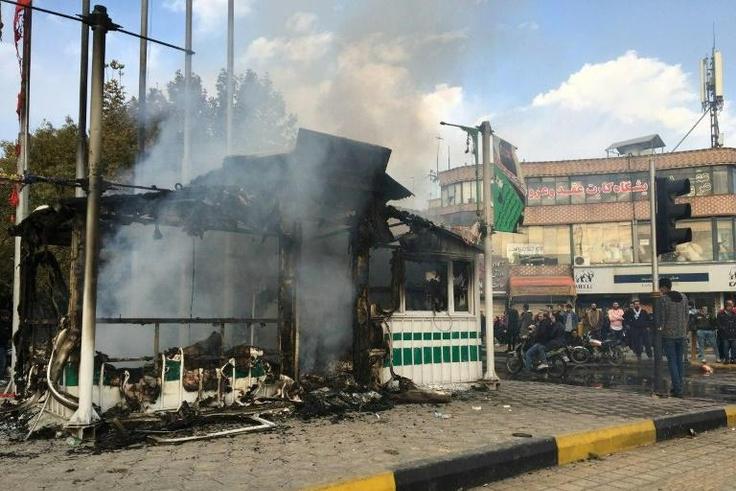 Iranian security force targets have come under attack by protesters in several cities, like this police station in the central city of Isfahan