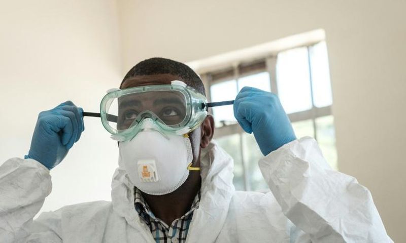 Virus threat: A lab technician gears up for visiting a quarantine ward at the Kenyatta National Hospital in Nairobi