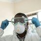 Virus threat: A lab technician gears up for visiting a quarantine ward at the Kenyatta National Hospital in Nairobi