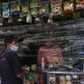 A man shops at a store covered with plastic as a precautionary measure against the spread of the new coronavirus, COVID-19, in Caracas, on March 17, 2020President Nicolas Maduro asked the International Monetary Fund on Tuesday for a $5 billion loan to ...