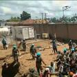 This frame grab taken from video footage shows crowds as they confront United Nations (UN) peackeepers in a UN compound on the outskirts of the eastern DRCongo town of Beni on November 25, 2019: protesters accused the UN troops of failing to protect th...