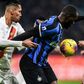 AS Roma defender Chris Smalling (L) holds off Inter Milan's forward Romelu Lukaku at the San Siro stadium in Milan.