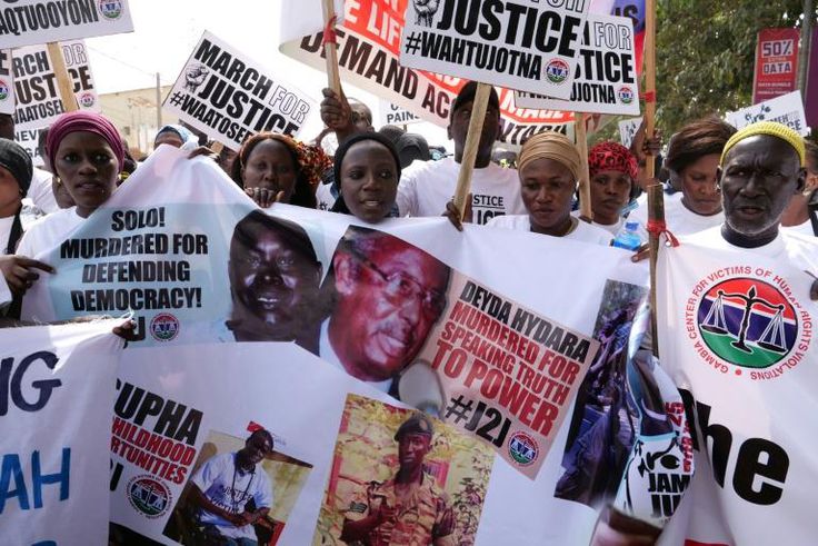 Wearing T-shirts that read #justicemustprevail, the protesters held photographs of people killed during Jammeh's rule