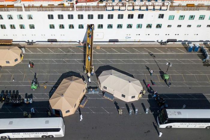 More passengers leave the Grand Princess cruise ship at the Port of Oakland in Oakland, California