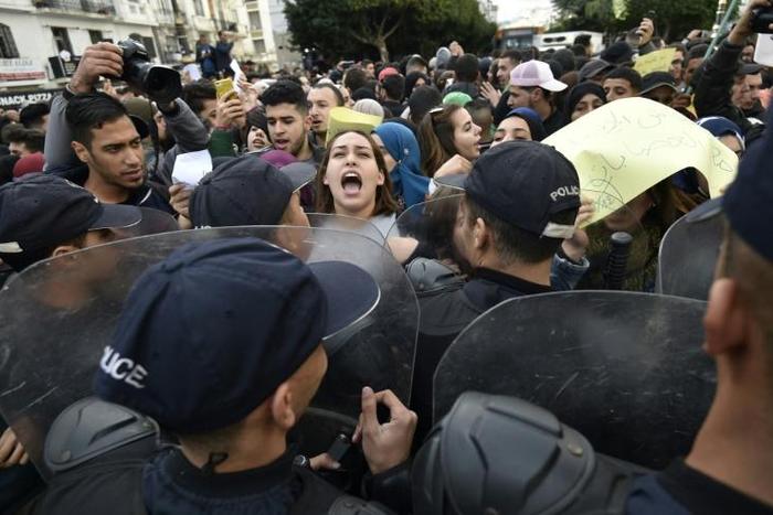 Some 200 people, mostly students, protested in central Algiers on Monday against a presidential election set for December 12