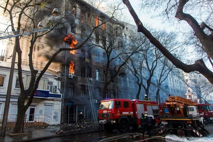 The blaze had been contained by Thursday morning, but dozens of firefighters were still combing through the partly destroyed walls of the six-storey building