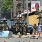 Protesters confront the Guinean army in the streets in Conakry on March 22, 2020, during a constitutional referendum in the country