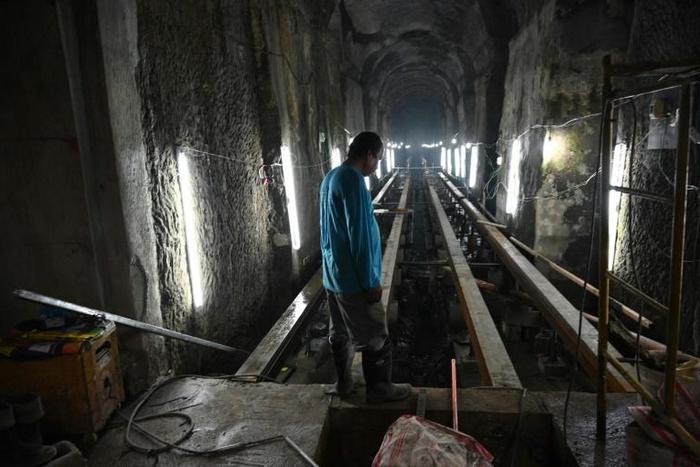 A worker stands near the entrance of El Deposito, a Spanish-era reservoir being redeveloped for tourism in suburban Manila