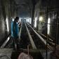 A worker stands near the entrance of El Deposito, a Spanish-era reservoir being redeveloped for tourism in suburban Manila