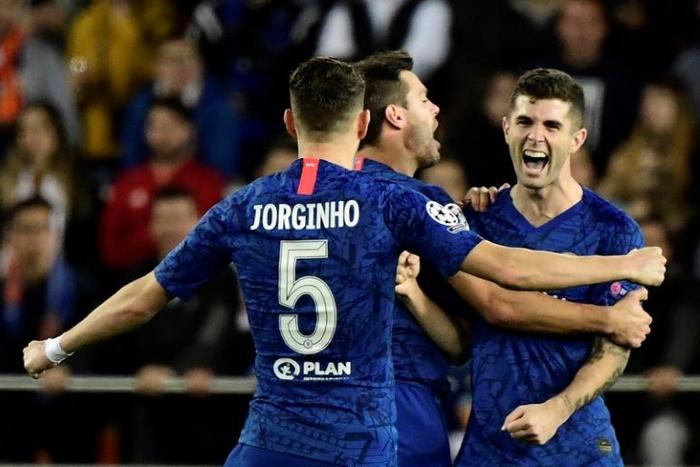Christian Pulisic (right) celebrates Chelsea's second goal in a 2-2 draw at Valencia