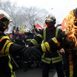 Some firefighters wearing special protective vests set fire to themselves