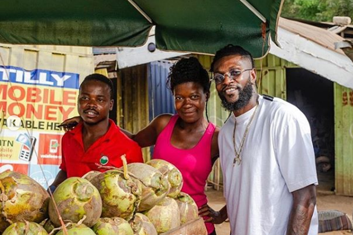 ‘God bless your hustle’ – Adebayor inspires couple selling coconut on the street