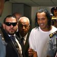Retired Brazilian football player Ronaldinho (C) arrives at the Justice Palace in Asuncion on March 6, 2020 
to testify about his irregular entry to the country