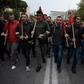 Over 30,000 Greeks demonstrated in Athens and other major cities under a heavy police presence Sunday to mark the anniversary of a 1973 anti-junta uprising