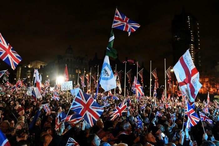 Brexit supporters wave Union flags as they gathered in Parliament Square on January 31, 2020, the day that the UK formally left the European Union
