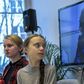 Greta Thunburg watches fellow eco warrior Vanessa Nakate, speaking from Kampala, after she was cropped out of a photo of young activists
