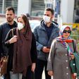 Some Iranians have begun wearing face masks amid a deadly coronavirus outbreak