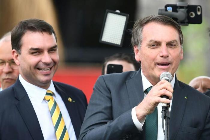 Brazilian President Jair Bolsonaro (R) and his son, Senator Flavio Bolsonaro, are pictured in November 2019