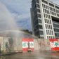 Lebanese anti-riot police fire tear gas and water cannons to try to prevent protesters scaling the blast walls around parliament