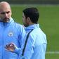 Manchester City manager Pep Guardiola (left) and assistant coach Mikel Arteta