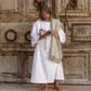 A worshipper prays in front of the closed door of the Holy Sepulchre Church in Jerusalem's Old City amid movement restrictions due to the coronavirus pandemic
