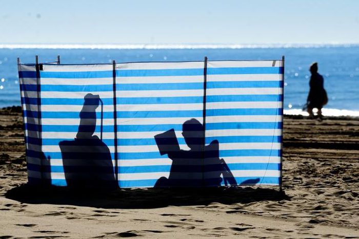 British residents and tourists bask in the sun on Spain's east coast -- but away from the beach, many say they are concerned about their future with Brexit now a reality