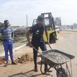 Police officer fills deadly potholes in Accra to save lives