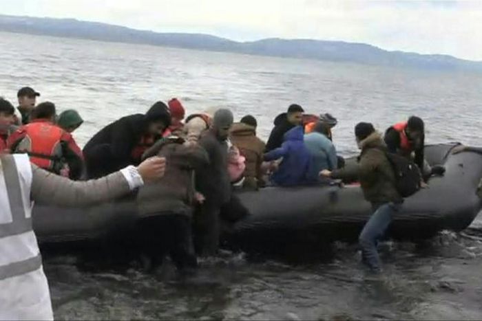 IMAGESMigrants arrive on Lesbos Island from Turkey, after Turkish officials said Ankara would no longer prevent refugees from going to Europe.