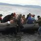 IMAGESMigrants arrive on Lesbos Island from Turkey, after Turkish officials said Ankara would no longer prevent refugees from going to Europe.