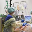Medical staff take care of a Covid-19 patient in the intensive care unit at the community hospital in Magdeburg, eastern Germany