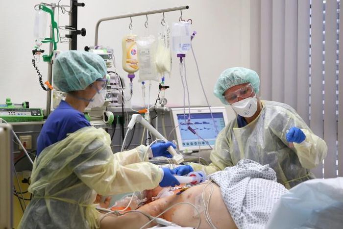 Medical staff take care of a Covid-19 patient in the intensive care unit at the community hospital in Magdeburg, eastern Germany