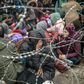 Through the barricades: Thousands of migrants have pushed up to the Turkey-Greece border