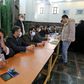 Organisers wear masks as they oversee voting in Iran's Friday parliamentary election days after the coronavirus outbreak first emerged