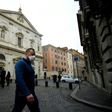 A man wearing a protective mask walks past the Church of St. Louis of the French (San Luigi dei Francesi) in Rome on March 1, 2020