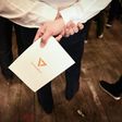 A supporter holds a leaflet with the logo of Thai political party Future Forward, which critics suggested showed links to the Illuminati
