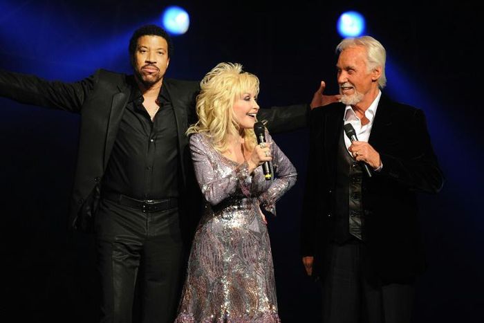 Kenny Rogers, pictured with Lionel Richie, came to prominence through his collaboration with Dolly Parton