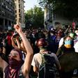 Demonstrators shout slogans during a protest against the government in Santiago on Monday
