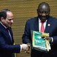 Handover: Outgoing AU chair Egyptian President Abdel Fattah al-Sisi, left, passes the baton to South African President Cyril Ramaphosa. Ramaphosa says settling the conflicts in Libya and South Sudan will be a priority of his tenure