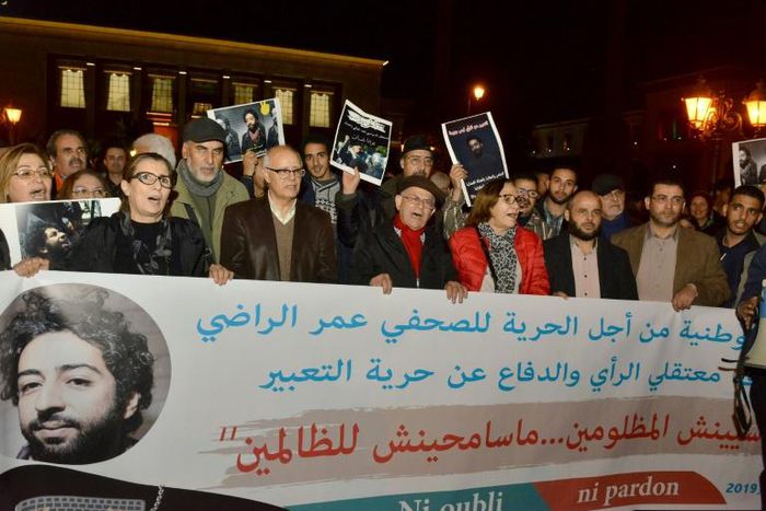 Demonstrators shout slogans during a protest in support of Omar Radi, a Moroccan journalist detained over tweet criticising a judge, on December 28, 2019, in the city of Rabat