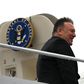 US Secretary of State Mike Pompeo boards his plane at Andrews Air Force Base en route to Munich on a trip that will include his first tour of sub-Saharan Africa