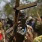 A soldier gestures with his wooden rifle at a UN-run programme to reconcile government troops with their former rebel enemies -- a key component of South Sudan's peace process