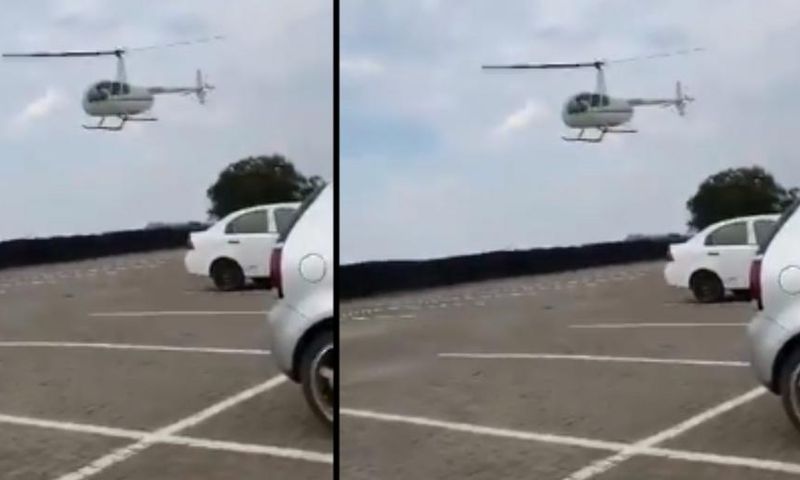 Parents use helicopter to deliver books to student on campus after he forgot them at home