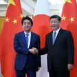 Japan's Prime Minister Shinzo Abe (left) shakes hand with China's President Xi Jinping at the Great Hall of the People in Beijing in December 2019