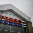 Tesco said it had stopped production at a factory in China after one of its charity cards was found to contain a cry for help from a prisoner who made it, according to the Sunday Times